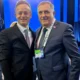 Szijjártó és Dodik egy minszki konferencián állt össze, a háttrében Szergej lóg be a képbe